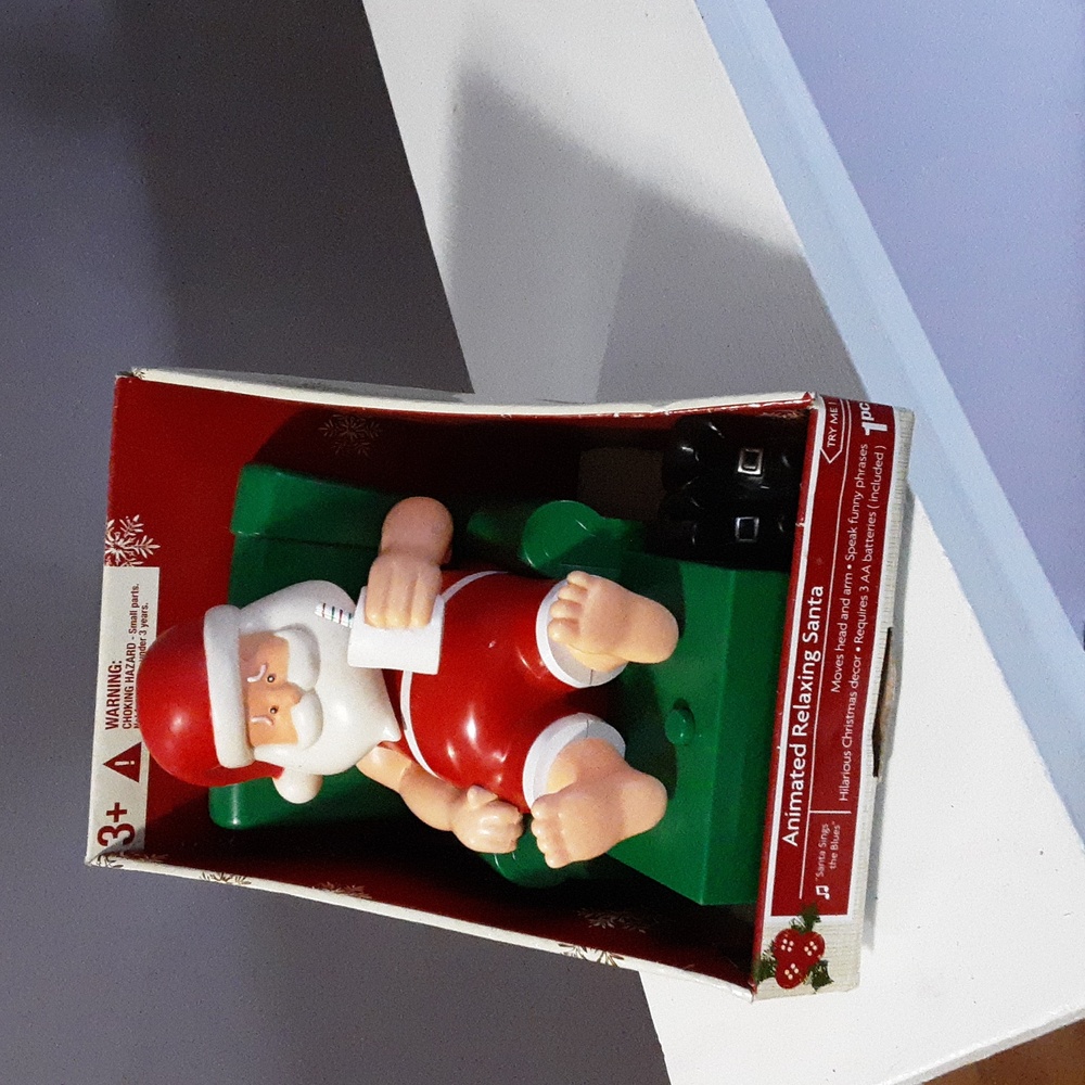 Animated relaxing Santa sings the blues.